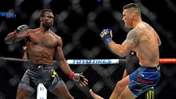 Apr 24, 2021; Jacksonville, Florida, USA; Chris Weidman (Blue Gloves) breaks his leg on a kick to the legs of Uriah Hall (Red Gloves) during UFC 261 at VyStar Veterans Memorial Arena. Mandatory Credit: Jasen Vinlove-USA TODAY Sports