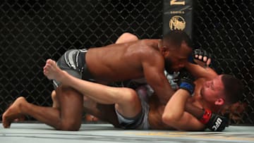 Jun 12, 2021; Glendale, Arizona, USA; Leon Edwards pins Nate Diaz to the mat during UFC 263 at Gila River Arena. Mandatory Credit: Mark J. Rebilas-USA TODAY Sports