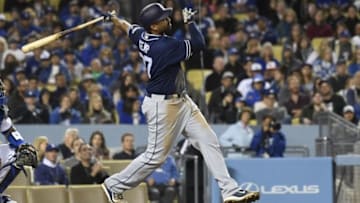 Apr 29, 2016; Los Angeles, CA, USA; San Diego Padres right fielder Matt Kemp (27) hits a three run home run against the Los Angeles Dodgers during the eighth inning at Dodger Stadium. Mandatory Credit: Richard Mackson-USA TODAY Sports