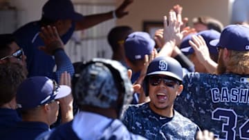 May 22, 2016; San Diego, CA, USA; San Diego Padres center fielder Jon Jay (24) celebrates with teammates in the dugout after scoring a run during the fifth inning against the Los Angeles Dodgers at Petco Park. Mandatory Credit: Jake Roth-USA TODAY Sports