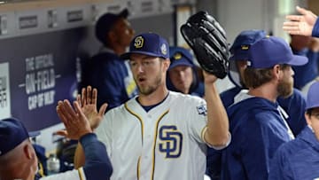 May 5, 2016; San Diego, CA, USA; San Diego Padres starting pitcher Colin Rea (29) gets a round of high-fives after the end of the top of the eighth inning against the New York Mets at Petco Park. Mandatory Credit: Jake Roth-USA TODAY Sports