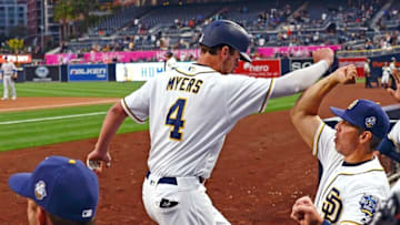 May 5, 2016; San Diego, CA, USA; San Diego Padres first baseman Wil Myers (4) is congratulated by hitting coach Alan Zinter (right) after hitting a solo home run during the first inning against the New York Mets at Petco Park. Mandatory Credit: Jake Roth-USA TODAY Sports