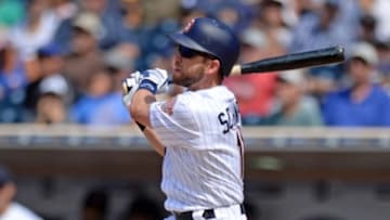 Aug 3, 2016; San Diego, CA, USA; San Diego Padres second baseman Ryan Schimpf (11) hits an RBI double during the seventh inning against the Milwaukee Brewers at Petco Park. Mandatory Credit: Jake Roth-USA TODAY Sports