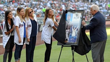 Aug 6, 2016; San Diego, CA, USA; San Diego Padres president Ron Fowler (R) presents the family of former third baseman Ken Caminiti with a plaque honoring his induction into the Padres Hall of Fame from left to right Lindse,y Nicole, Nancy, and Kendall Caminiti at Petco Park. Mandatory Credit: Jake Roth-USA TODAY Sports
