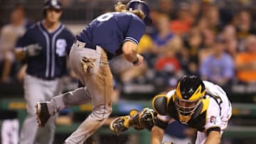 Aug 10, 2016; Pittsburgh, PA, USA; San Diego Padres center fielder Travis Jankowski (C) steals home plate as Pittsburgh Pirates catcher Eric Fryer (24) drops the ball during the eighth inning at PNC Park. Mandatory Credit: Charles LeClaire-USA TODAY Sports