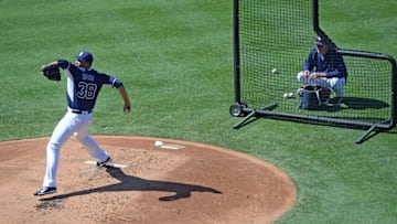Aug 20, 2016; San Diego, CA, USA; San Diego Padres starting pitcher Tyson Ross (38) throws live batting practice as pitching coach Darren Balsley (36) watches before the game against the Arizona Diamondbacks at Petco Park. Mandatory Credit: Jake Roth-USA TODAY Sports