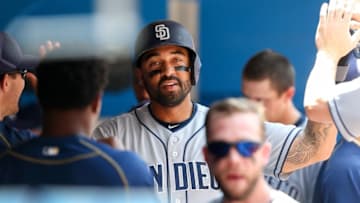 Jul 27, 2016; Toronto, Ontario, CAN; San Diego Padres right fielder Matt Kemp (27) is congratulated by teammates in the dugout after scoring a run against the Toronto Blue Jays in the sixth inning at Rogers Centre. Mandatory Credit: Kevin Sousa-USA TODAY Sports
