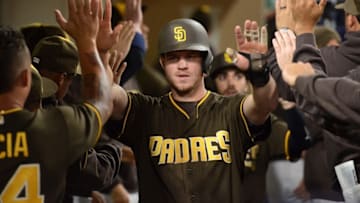 Sep 23, 2016; San Diego, CA, USA; San Diego Padres first baseman Wil Myers (C) and third baseman Carlos Asuaje (background) are congratulated after scoring on a single by left fielder Alex Dickerson (not pictured) during the fifth inning against the San Francisco Giants at Petco Park. Mandatory Credit: Jake Roth-USA TODAY Sports
