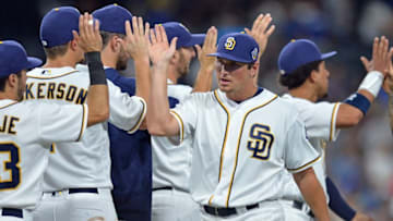 Sep 28, 2016; San Diego, CA, USA; San Diego Padres right fielder Hunter Renfroe (center) celebrates a 6-5 win over the Los Angeles Dodgers with teammmates at Petco Park. Mandatory Credit: Jake Roth-USA TODAY Sports