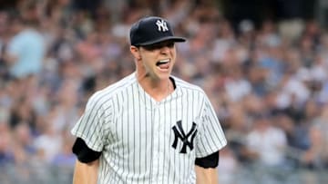 NEW YORK, NY - JULY 26: Sonny Gray #55 of the New York Yankees celebrates the final out of the third inning after Mike Moustakas #8 of the Kansas City Royals struck out with the bases loaded at Yankee Stadium on July 26, 2018 in the Bronx borough of New York City. (Photo by Elsa/Getty Images)