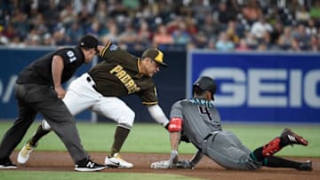 SAN DIEGO, CA - AUGUST 17: Ketel Marte #4 of the Arizona Diamondbacks slides into second base with a double ahead of the the tag of Christian Villanueva #22 of the San Diego Padres during the second inning of a baseball game at PETCO Park on August 17, 2018 in San Diego, California. (Photo by Denis Poroy/Getty Images)