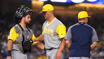 LOS ANGELES, CA - AUGUST 24: Austin Hedges #18 looks on as manager Andy Green #14 pulls starting pitcher Clayton Richard #3 of the San Diego Padres in the fourth inning against the Los Angeles Dodgers at Dodger Stadium on August 24, 2018 in Los Angeles, California. (Photo by Jayne Kamin-Oncea/Getty Images)