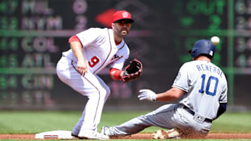 WASHINGTON, DC - APRIL 28: Hunter Renfroe #10 of the San Diego Padres steals second base ahead of the throw to Brian Dozier #9 of the Washington Nationals in the second inning at Nationals Park on April 28, 2019 in Washington, DC. (Photo by Greg Fiume/Getty Images)