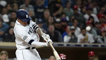 SAN DIEGO, CA - JUNE 3: Manny Machado #13 of the San Diego Padres hits a grand slam during the sixth inning of a baseball game against the Philadelphia Phillies at Petco Park June 3, 2019 in San Diego, California. (Photo by Denis Poroy/Getty Images)