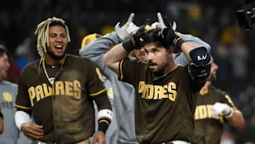 SAN DIEGO, CA - JUNE 7: Austin Hedges #18 of the San Diego Padres, right, celebrates next to Fernando Tatis Jr. #23 after hitting a walk-off single during the ninth inning of a baseball game against the Washington Nationals at Petco Park on June 7, 2019 in San Diego, California. The Padres won 5-4. (Photo by Denis Poroy/Getty Images)