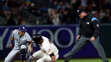 SAN FRANCISCO, CA - JUNE 12: Donovan Solano #7 of the San Francisco Giants slides into second base for a double ahead of a tag from Ian Kinsler #3 of the San Diego Padres during the seventh inning at Oracle Park on June 12, 2019 in San Francisco, California. The San Francisco Giants defeated the San Diego Padres 4-2. (Photo by Jason O. Watson/Getty Images)