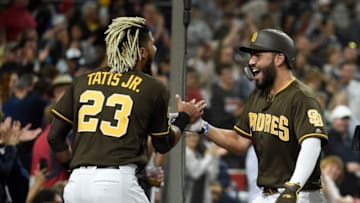SAN DIEGO, CA - JUNE 28: Eric Hosmer #30 of the San Diego Padres, right, is congratulated by Fernando Tatis Jr. #23 after hitting a solo home run during the sixth inning of a baseball game against the St. Louis Cardinals at Petco Park June 28, 2019 in San Diego, California. (Photo by Denis Poroy/Getty Images)
