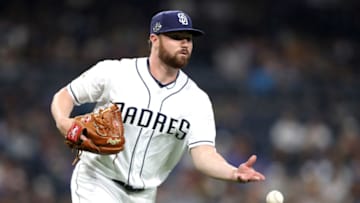 SAN DIEGO, CALIFORNIA - JUNE 18: Logan Allen #54 of the San Diego Padres fields a bunt by Hernan Perez #14 of the Milwaukee Brewers during the fifth inning of a game against the Milwaukee Brewers at PETCO Park on June 18, 2019 in San Diego, California. (Photo by Sean M. Haffey/Getty Images)