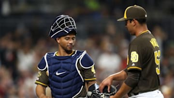 SAN DIEGO, CALIFORNIA - JULY 12: Francisco Mejia #27 gives the ball to Andres Munoz #54 of the San Diego Padres pitches after the sixth inning of a game against the Atlanta Braves at PETCO Park on July 12, 2019 in San Diego, California. (Photo by Sean M. Haffey/Getty Images)