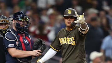 SAN DIEGO, CALIFORNIA - JULY 12: Manny Machado #13 of the San Diego Padres reacts to hitting a solo homerum as Brian McCann #16 of the Atlanta Braves looks on during the sixth inning of a game at PETCO Park on July 12, 2019 in San Diego, California. (Photo by Sean M. Haffey/Getty Images)