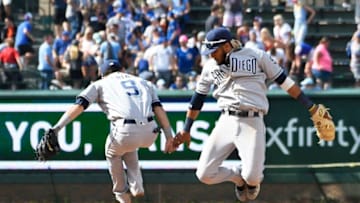 CHICAGO, ILLINOIS - JULY 21: Fernando Tatis Jr. #23 of the San Diego Padres and Luis Urias #9 celebrate their 5-1 win against the Chicago Cubs at Wrigley Field on July 21, 2019 in Chicago, Illinois. (Photo by David Banks/Getty Images)