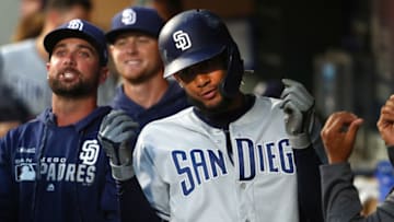 SEATTLE, WASHINGTON - AUGUST 06: Fernando Tatis Jr. #23 of the San Diego Padres celebrates in the dugout after hitting a two run home run against the Seattle Mariners in the fifth inning during their game at T-Mobile Park on August 06, 2019 in Seattle, Washington. (Photo by Abbie Parr/Getty Images)