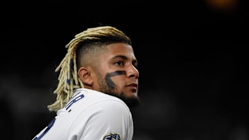 SAN DIEGO, CA - AUGUST 10: Fernando Tatis Jr. #23 of the San Diego Padres looks out from the dugout during a baseball game against the Colorado Rockies at Petco Park August 10, 2019 in San Diego, California. (Photo by Denis Poroy/Getty Images)