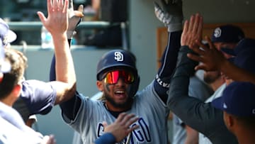 SEATTLE, WASHINGTON - AUGUST 07: Fernando Tatis Jr. #23 of the San Diego Padres celebrates in the dugout after hitting a leadoff home run against the Seattle Mariners in the first inning during their game at T-Mobile Park on August 07, 2019 in Seattle, Washington. (Photo by Abbie Parr/Getty Images)