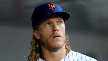 NEW YORK, NEW YORK - AUGUST 22: Noah Syndergaard #34 of the New York Mets looks on from the dugout before the game against the Cleveland Indians at Citi Field on August 22, 2019 in the Flushing neighborhood of the Queens borough of New York City. (Photo by Elsa/Getty Images)