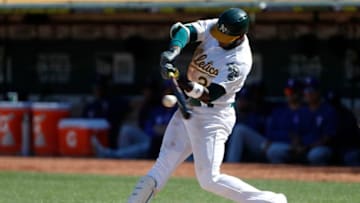 OAKLAND, CA - SEPTEMBER 22: Jurickson Profar #23 of the Oakland Athletics connects for a single during the sixth inning against the Texas Rangers at Ring Central Coliseum on September 22, 2019 in Oakland, California. The Rangers defeated the Athletics 8-3. (Photo by Stephen Lam/Getty Images)