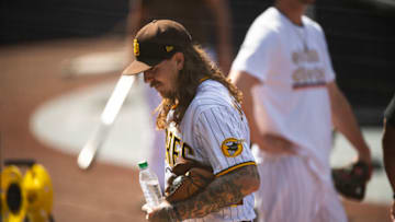 SAN DIEGO, CA - SEPTEMBER 29: Mike Clevinger #52 of the San Diego Padres walks into the dugout after his workout at PETCO Park on September 29, 2020 in San Diego, California. (Photo by Matt Thomas/San Diego Padres/Getty Images)