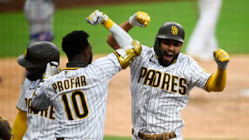 SAN DIEGO, CA - AUGUST 20: Eric Hosmer #30 of the San Diego Padres is congratulated by Jurickson Profar #10 after hitting a grand slam during the fifth inning of a baseball game against the Texas Rangers at Petco Park on August 20, 2020 in San Diego, California. (Photo by Denis Poroy/Getty Images)