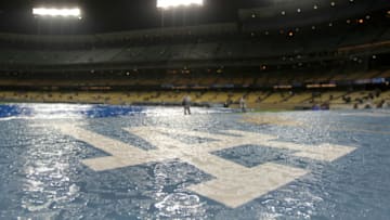 LOS ANGELES, CA - APRIL 02: The Los Angeles Dodgers logo is seen soaked with rain during a rain delay of the game against the San Francisco Giants on April 2,2008 at Dodger Stadium in Los Angeles,California. (Photo by Harry How/Getty Images)