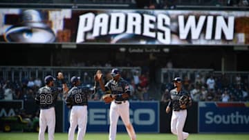 SAN DIEGO, CA - JULY 16: San Diego Padres players high five after beating the San Francisco Giants 7-1 in a baseball game at PETCO Park on July 16, 2017 in San Diego, California. (Photo by Denis Poroy/Getty Images)
