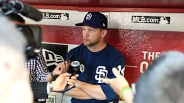 PHOENIX, AZ - APRIL 20: Manager Andy Green #14 of the San Diego Padres talks with the media in the dugout prior to a game against the Arizona Diamondbacks at Chase Field on April 20, 2018 in Phoenix, Arizona. (Photo by Norm Hall/Getty Images)