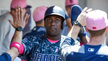 SAN DIEGO, CA - MAY 13: Jose Pirela #2 of the San Diego Padres is congratulated after scoring during the third inning of a baseball game against the St. Louis Cardinals at PETCO Park on May 13, 2018 in San Diego. (Photo by Denis Poroy/Getty Images)