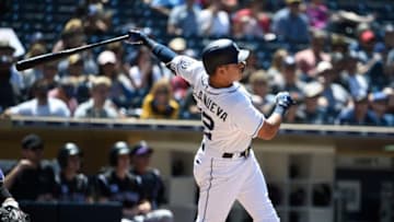 SAN DIEGO, CA - MAY 15: Christian Villanueva #22 of the San Diego Padres hits a two-run home run during the sixth inning of a baseball game against the Colorado Rockies at PETCO Park on May 15, 2018 in San Diego, California. (Photo by Denis Poroy/Getty Images)