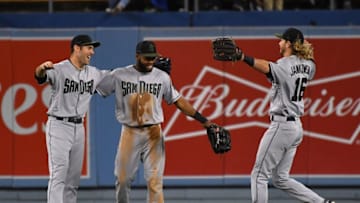 LOS ANGELES, CA - MAY 26: Matt Szczur #23, Manuel Margot #7 and Travis Jankowski #16 of the San Diego Padres celebrate after defeating the Los Angeles Dodgers at Dodger Stadium on May 26, 2018 in Los Angeles, California. (Photo by Jayne Kamin-Oncea/Getty Images)