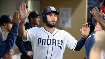 SAN DIEGO, CA - MAY 31: Eric Hosmer #30 of the San Diego Padres is congratulated after scoring during the fifth inning of a baseball game against the Miami Marlins at PETCO Park on May 31, 2018 in San Diego, California. (Photo by Denis Poroy/Getty Images)
