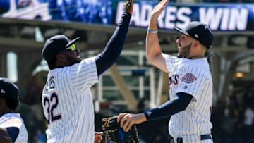 SAN DIEGO, CA - JUNE 6: Franmil Reyes #32 of the San Diego Padres, left, and Eric Hosmer #30 celebrate after beating the Atlanta Braves 3-1 in a baseball game at PETCO Park on June 6, 2018 in San Diego, California. (Photo by Denis Poroy/Getty Images)