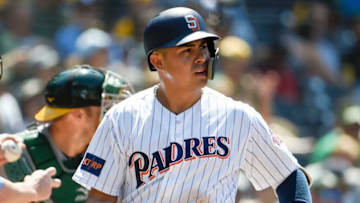 SAN DIEGO, CA - JUNE 20: Christian Villanueva #22 of the San Diego Padres walks back to the dugout after striking out during the seventh inning of a baseball game against the Oakland Athletics at PETCO Park on June 20, 2018 in San Diego, California. (Photo by Denis Poroy/Getty Images)