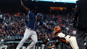 SAN FRANCISCO, CA - JUNE 21: Jose Pirela #2 of the San Diego Padres is tagged out at home plate by Buster Posey #28 of the San Francisco Giants during the fifth inning at AT&T Park on June 21, 2018 in San Francisco, California. The San Francisco Giants defeated the San Diego Padres 3-0. (Photo by Jason O. Watson/Getty Images)