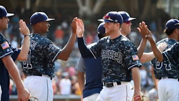 SAN DIEGO, CA - JULY 16: San Diego Padres players high five after beating the San Francisco Giants 7-1 in a baseball game at PETCO Park on July 16, 2017 in San Diego, California. (Photo by Denis Poroy/Getty Images)