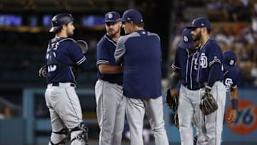 LOS ANGELES, CA - SEPTEMBER 25: Pitching coach Darren Balsley of the San Diego Padres talks to catcher Austin Hedges