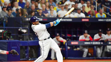 ST PETERSBURG, FLORIDA - OCTOBER 07: Nelson Cruz #23 of the Tampa Bay Rays hits a solo homerun in the third inning against the Boston Red Sox during Game 1 of the American League Division Series at Tropicana Field on October 07, 2021 in St Petersburg, Florida. (Photo by Julio Aguilar/Getty Images)