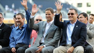 SAN DIEGO, CA - SEPTEMBER 15: (L-R) San Diego Padres owners Peter Seidler, Kevin O'Malley and Tom Seidler wave during a ceremony on Jerry Coleman Day before a game between the Colorado Rockies and the San Diego Padres at Petco Park on September 15, 2012 in San Diego, California. (Photo by Denis Poroy/Getty Images)