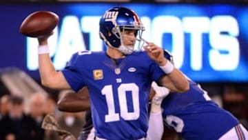 Nov 15, 2015; East Rutherford, NJ, USA; New York Giants quarterback Eli Manning (10) drops back to pass against the New England Patriots in the first half during the game at MetLife Stadium. Mandatory Credit: Robert Deutsch-USA TODAY Sports