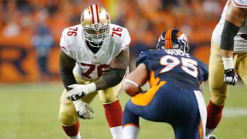 Oct 19, 2014; Denver, CO, USA; San Francisco 49ers tackle Anthony Davis (76) lines up against Denver Broncos defensive end Derek Wolfe (95) during the game against the Denver Broncos at Sports Authority Field at Mile High. Mandatory Credit: Chris Humphreys-USA TODAY Sports