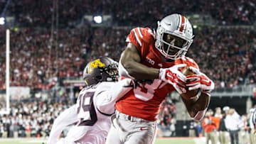 Nov 7, 2015; Columbus, OH, USA; Ohio State Buckeyes wide receiver Michael Thomas (3) catches a touchdown pass under pressure from Minnesota Golden Gophers defensive back Briean Boddy-Calhoun (29) at Ohio Stadium. Mandatory Credit: Greg Bartram-USA TODAY Sports