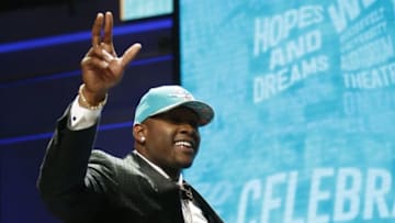 Apr 28, 2016; Chicago, IL, USA; Laremy Tunsil (Mississippi) is selected by the Miami Dolphins as the number thirteen overall pick in the first round of the 2016 NFL Draft at Auditorium Theatre. Mandatory Credit: Kamil Krzaczynski-USA TODAY Sports